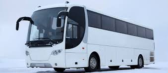 A large motor vehicle carrying passengers by road, typically one serving the public on a fixed route and for a fare.